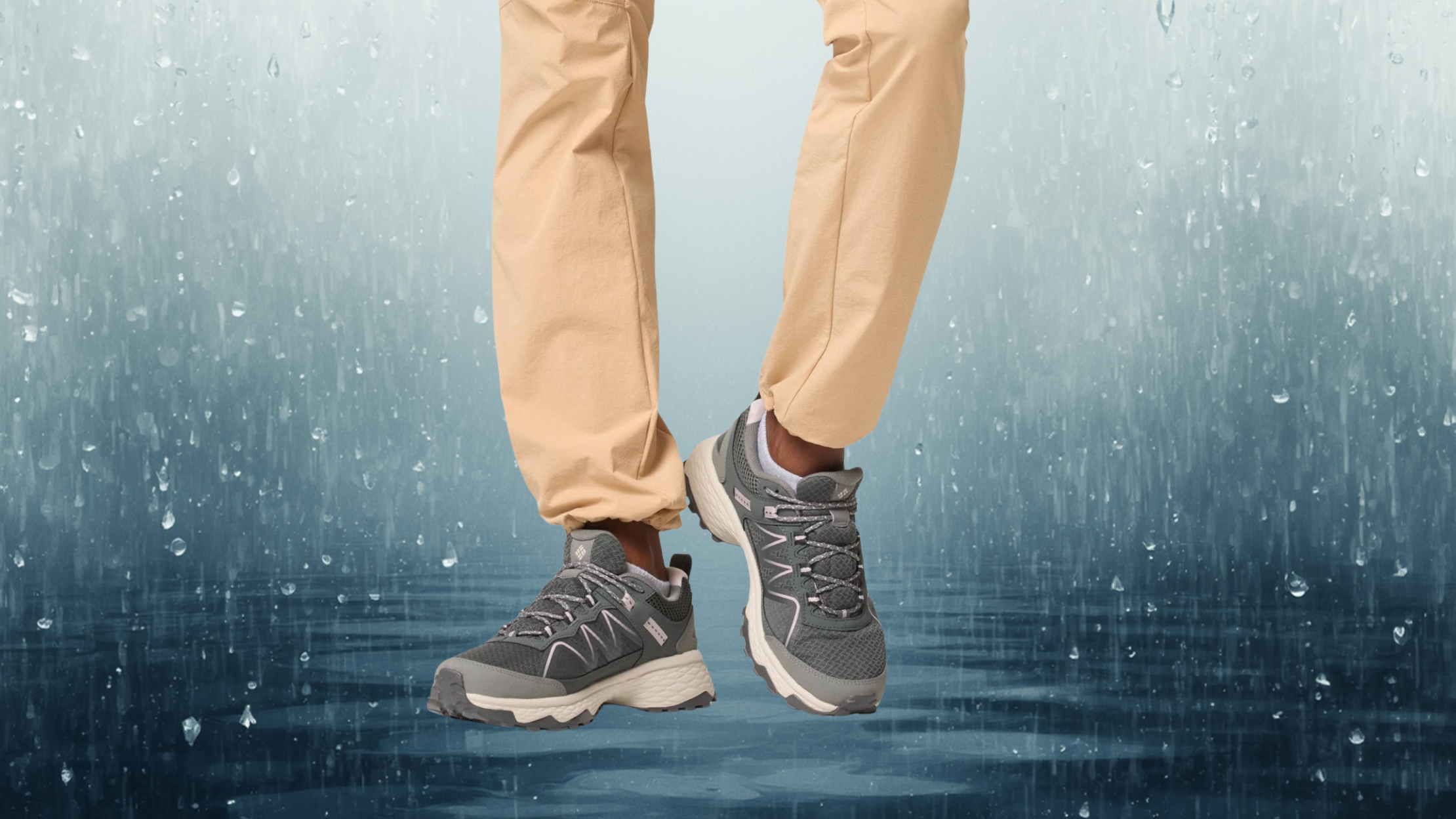 Columbia Women's Peakfreak modelled by someone in sandy colored cargo pants on a rainy background