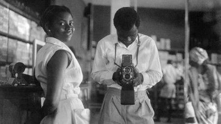  James Barnor Self-portrait with a store assistant at the West African Drug Company, central Accra,c. 1952