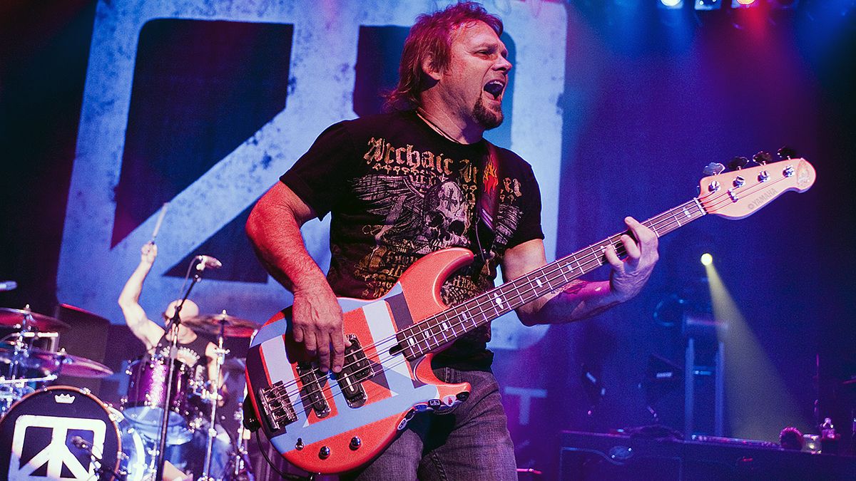 Michael Anthony playing bass guitar live