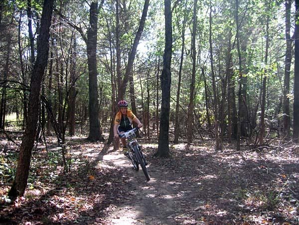 A kid rides some singletrack on Take a Kid Mountain Biking Day.