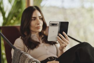 Google Pixel Fold being held by woman