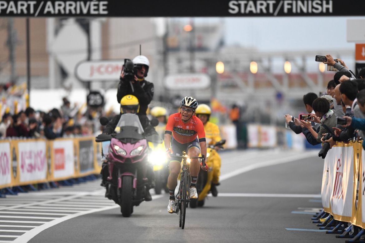 Yukiya Arashiro crosses the line for third place
