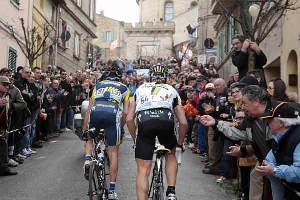 Breakaway riders Borut Bozic, left, and Bert Grabsch are cheered on by spectators on the Macerata circuit's finishing climb.