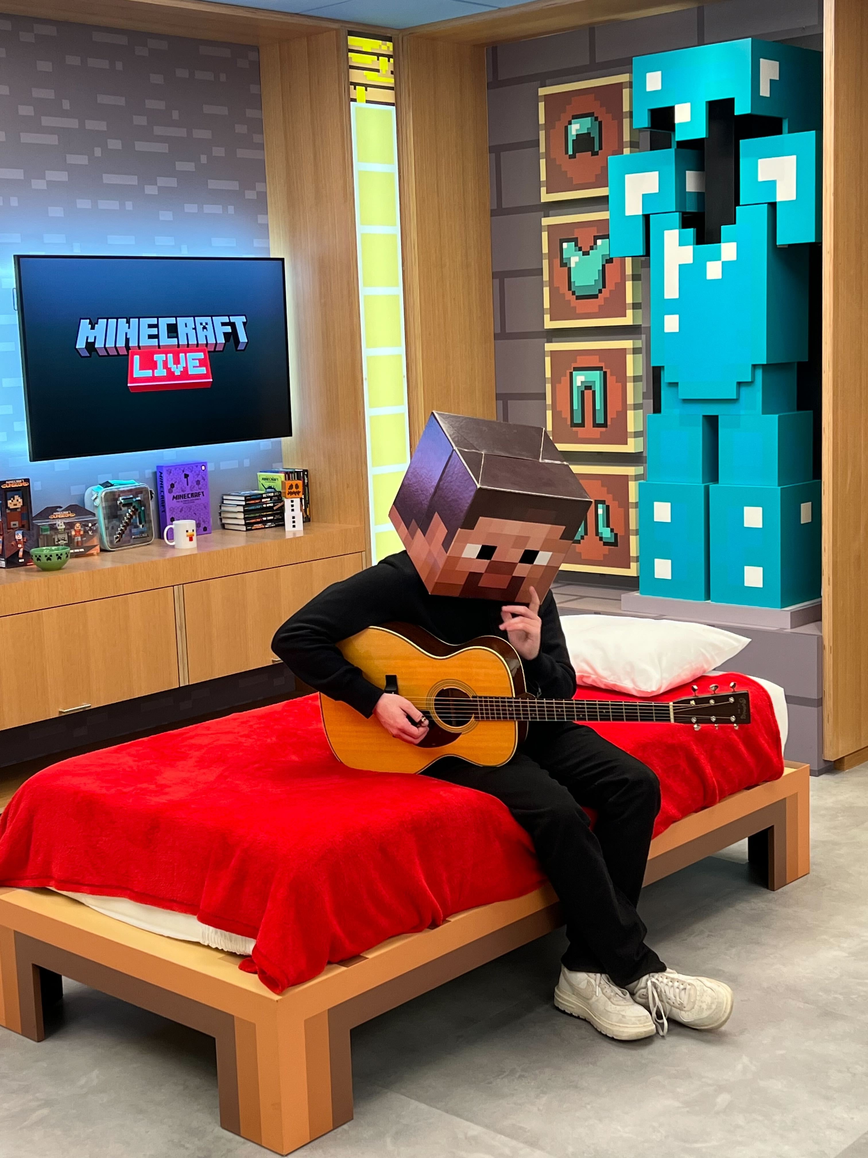 Alec Benjamin wearing a Minecraft Steve helmet at Minecraft Live 2023?