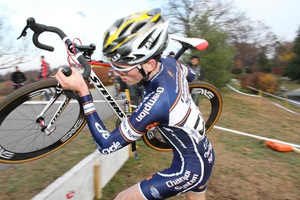 Nicholas Keough (Champion System p/b Keough Cyclocross) jumps the fence to the start the last lap.