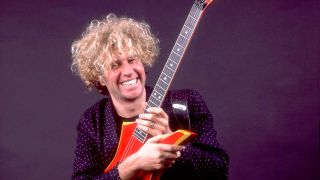 Sammy Hagar cradling a guitar