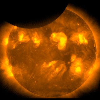 This photo was taken by the sun-watching Hinode satellite two minutes before the end of the partial solar eclipse on May 20, 2012.