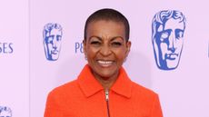 Adjoa Andoh wearing orange ME+EM co-ord on the BAFTAS 2026 red carpet