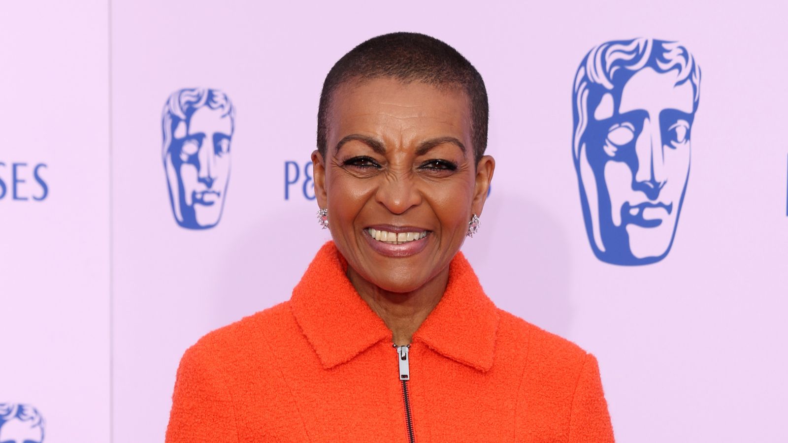 Adjoa Andoh wearing orange ME+EM co-ord on the BAFTAS 2026 red carpet