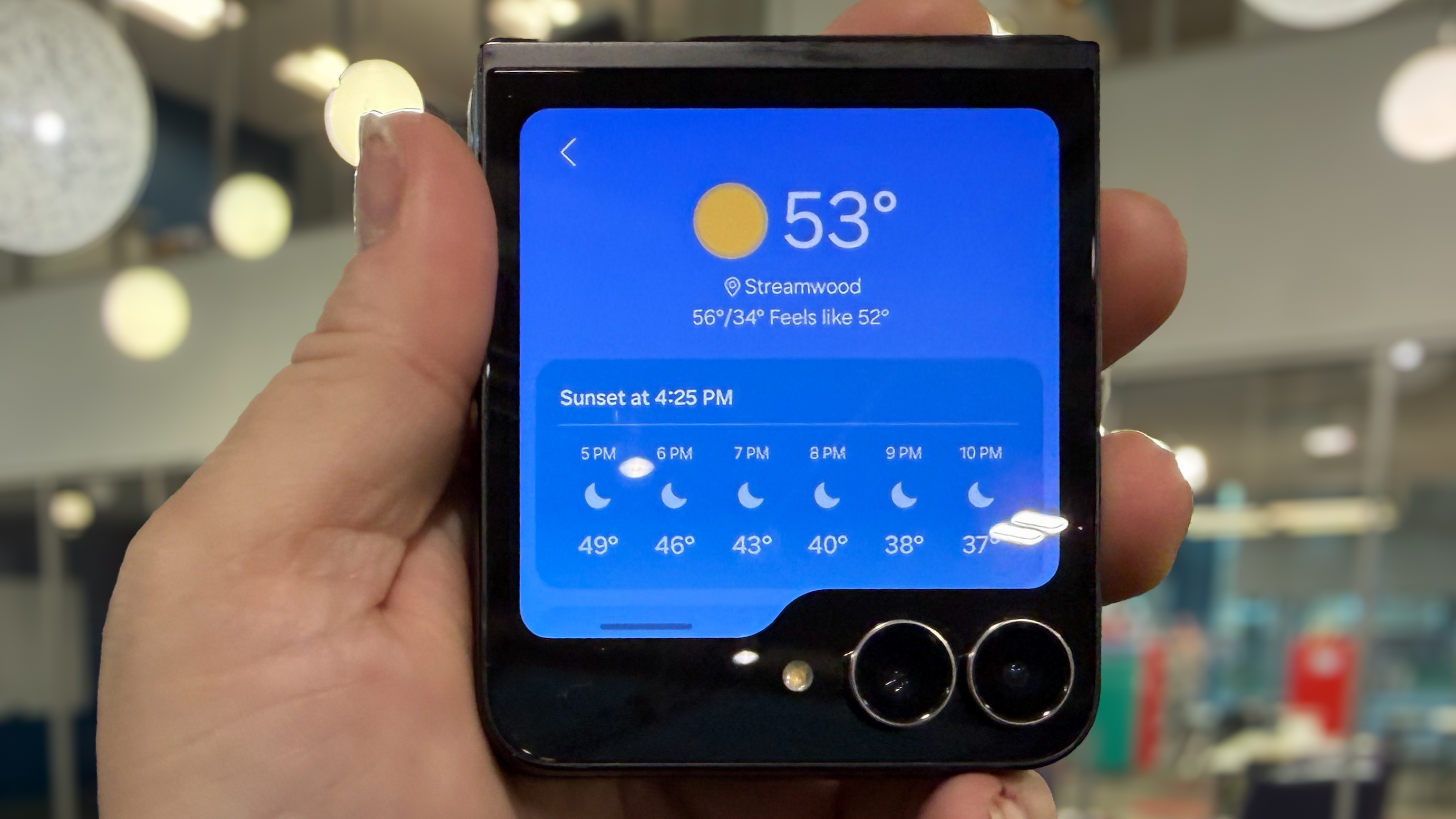 Samsung Galaxy Z Flip 7 FE in piano black color showing content on the cover display and the main screen