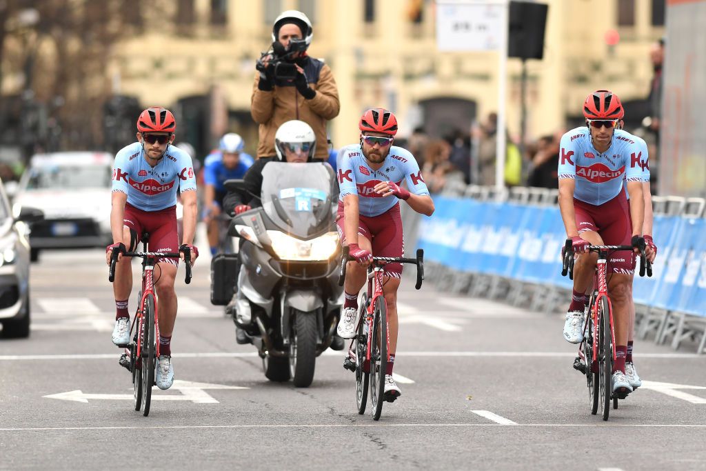 The Katusha-Alpecin team cross the line after being caught up a crash in the final kilometre