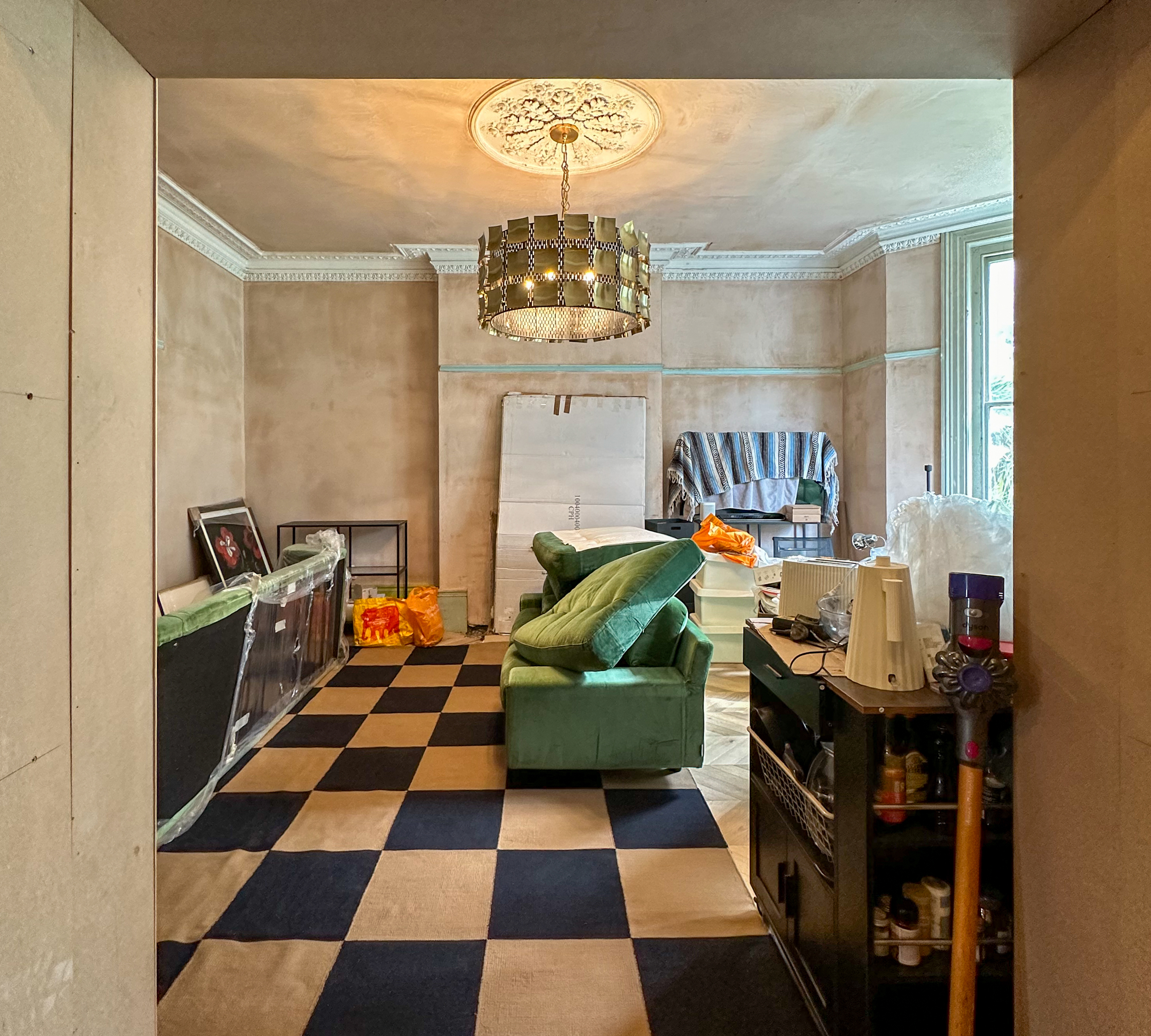 living room with large light in the middle of the room