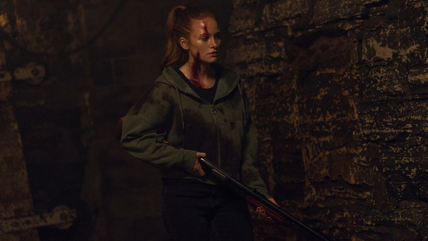 Madelaine Petsch carrying a shotgun in the strangers: chapter 3