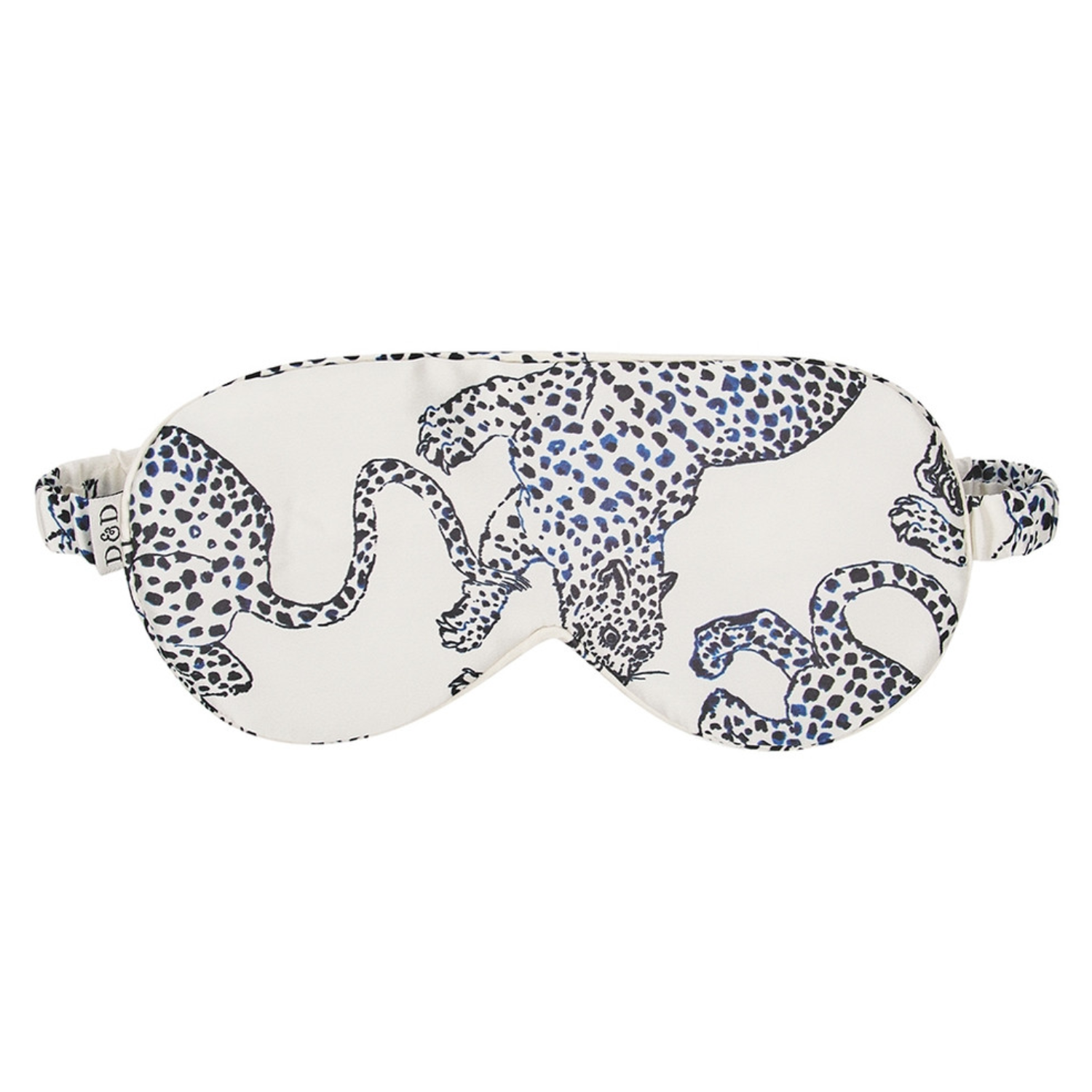 A white silk sleep mask with a navy jaguar print