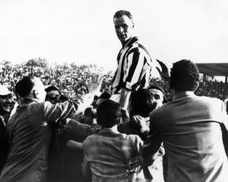 John Charles is held aloft by supporters after he led his team Juventus to victory in the Italian Cup at Turin.