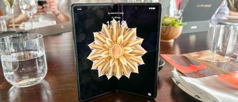 Honor Magic V2 partly open, stood on table