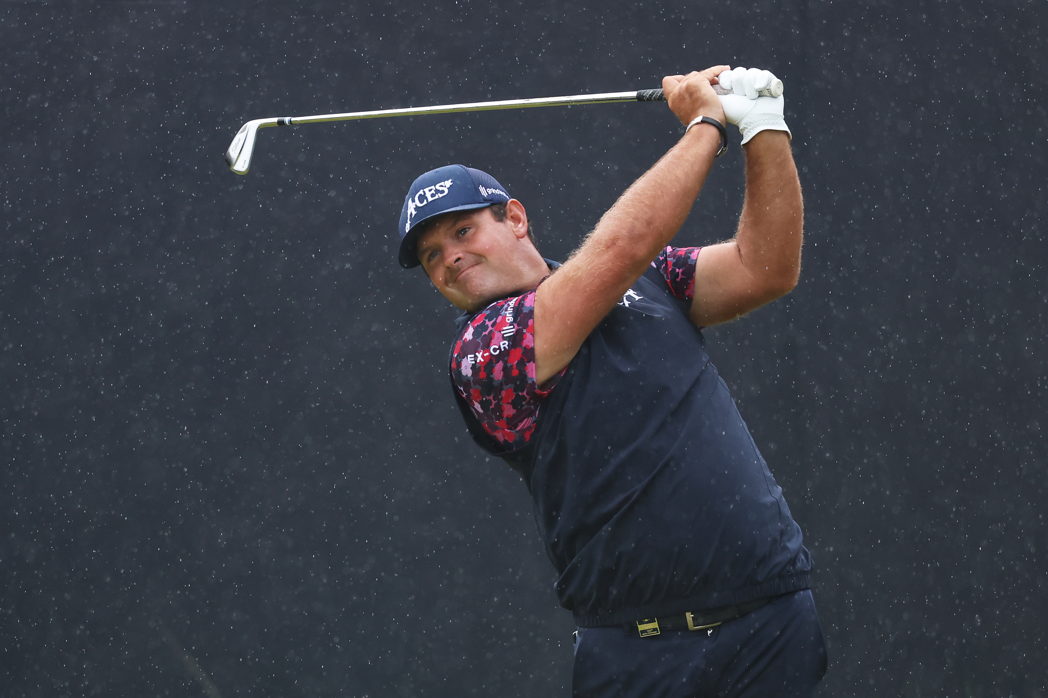 Patrick Reed hits an iron off the tee