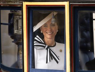 Catherine, Duchess of Wales, arriving at the Trooping of the King's Colors celebrations, dressed in a black and white bow dress 