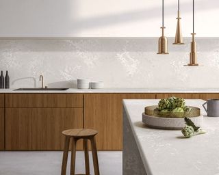 Oak cabinet kitchen with white backsplash and brass tap