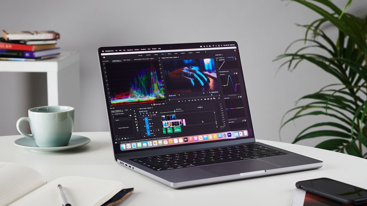 MacBook Pro 14-inch on a table in an office