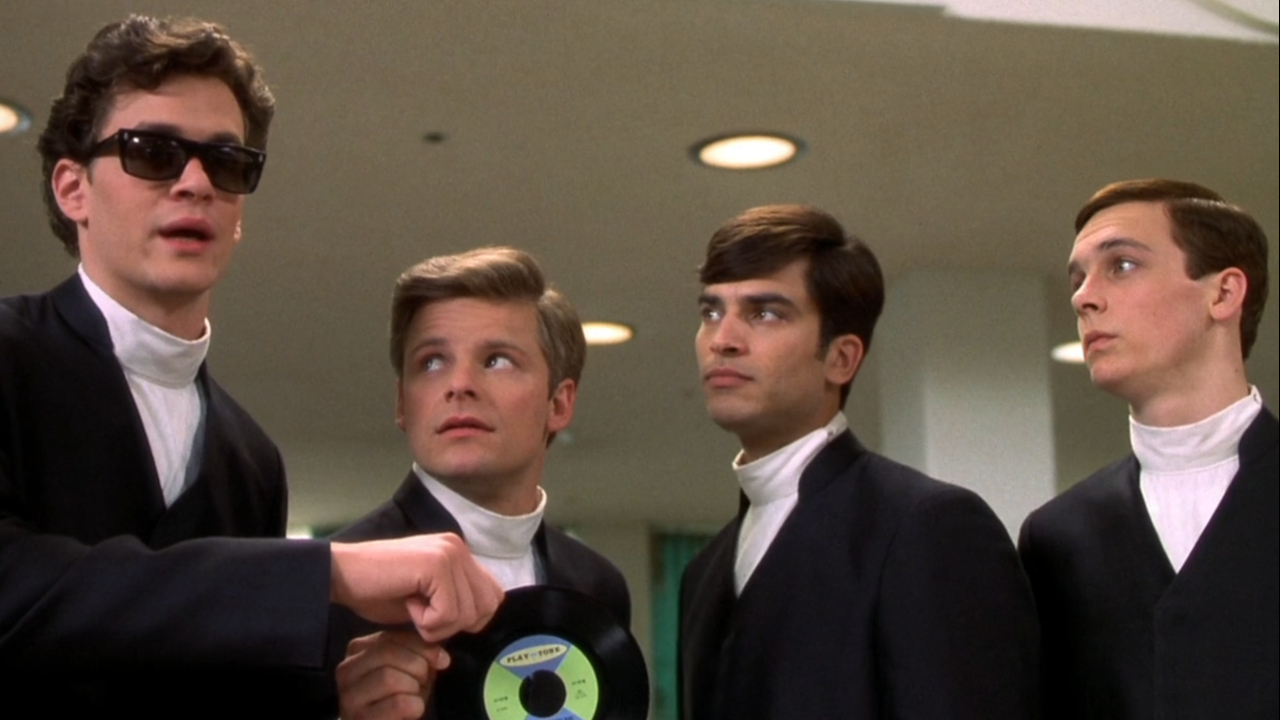 Tom Everett Scott, Steve Zahn, Johnathon Schaech, and Ethan Embry pose for a photo with their record in That Thing You Do!