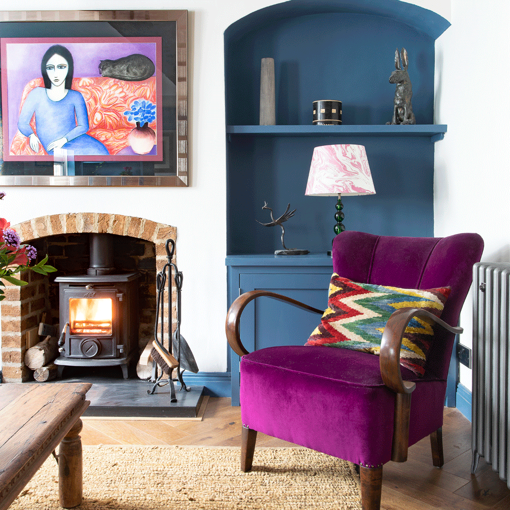 living room with purple armchair and white walls