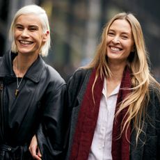 two women with blonde toned hair walking 