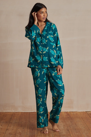woman wearing elizabeth scarlett pyjama set with a turtle print