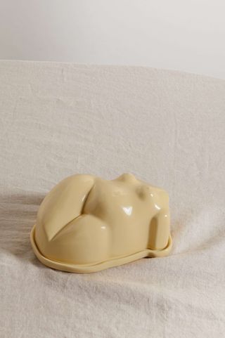creamy yellow butter dish in the shape of a female form