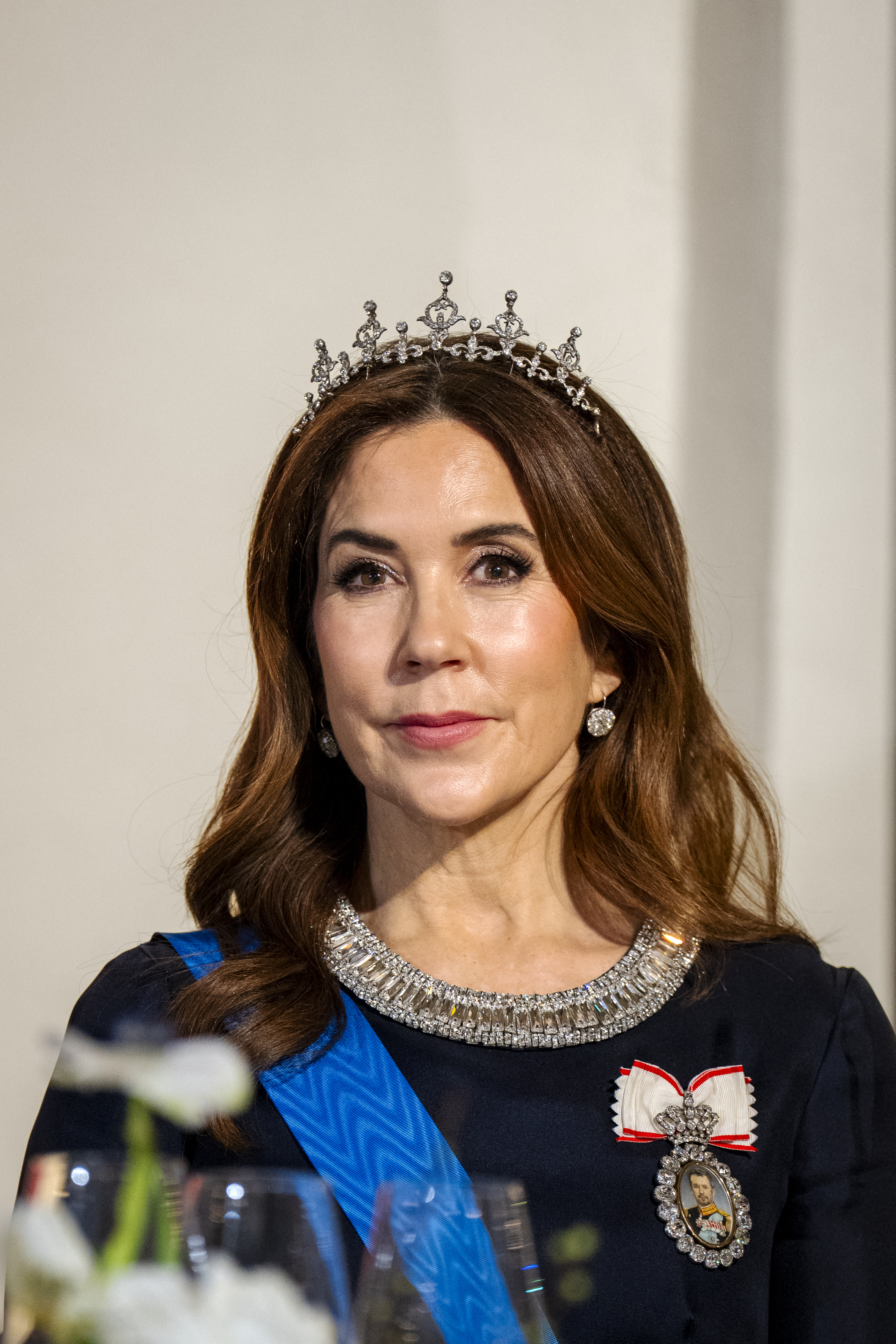 Queen Mary wearing her wedding tiara and a blue dress