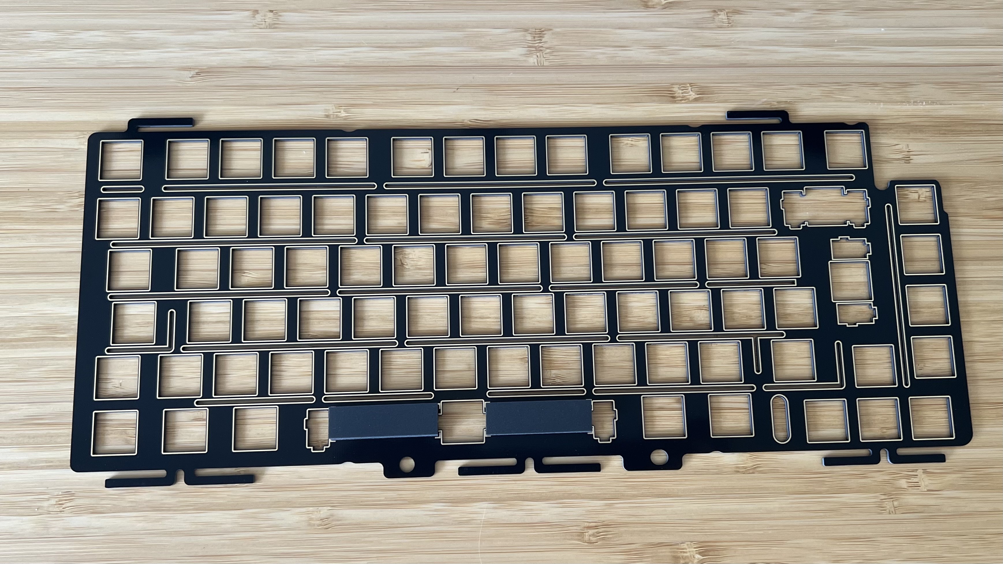 Corsair MAKR FR4 switch plate on a wooden desk