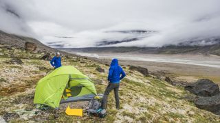 how to keep your tent clean while camping: wild campers setting up