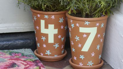 Quirky house number pots. Terracotta pots with bright hand painted house numbers
