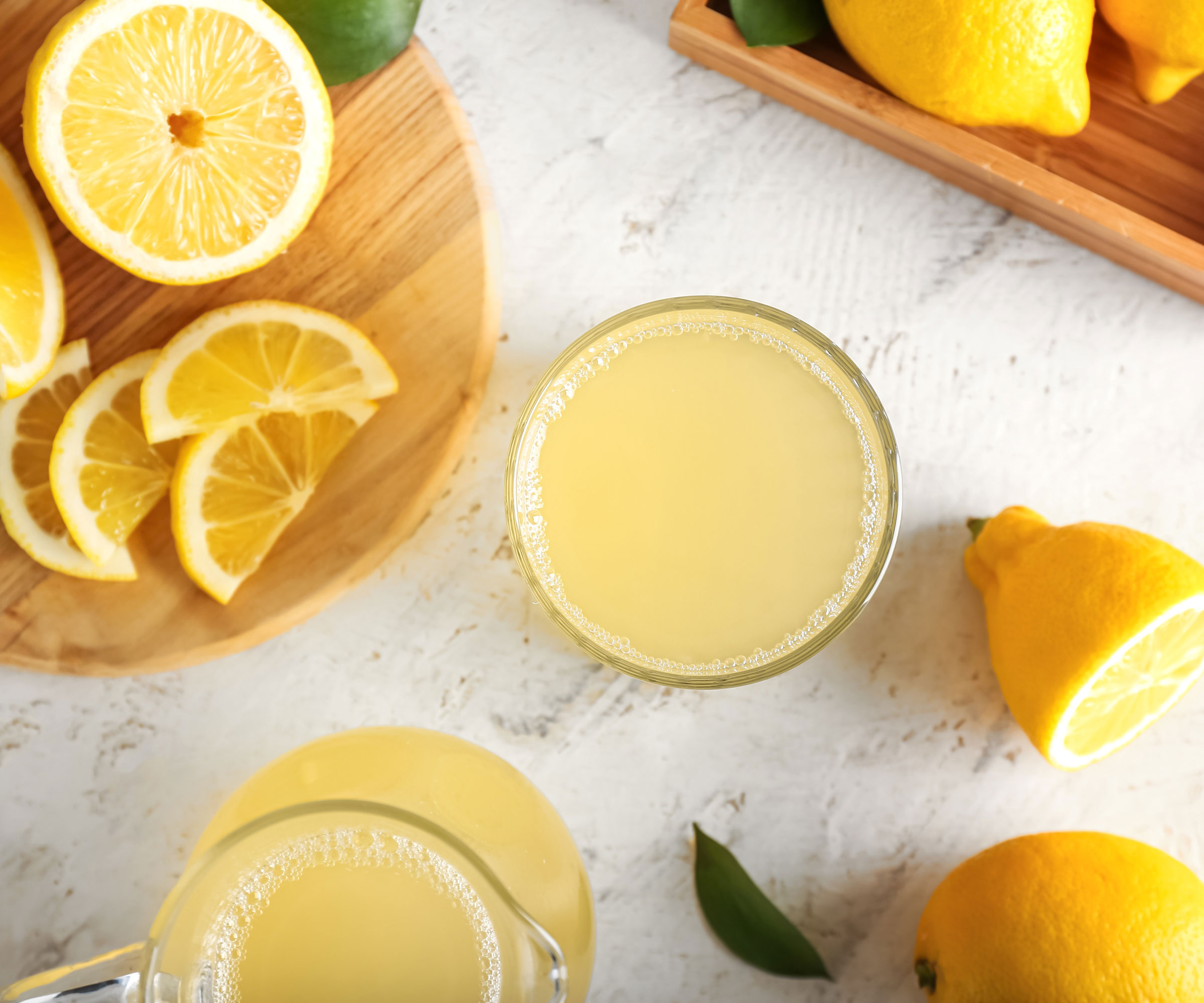lemon juice and lemons on worktop