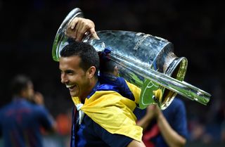 Pedro celebrates with the Champions League trophy after Barcelona's win over Juventus in the 2015 final in Berlin.