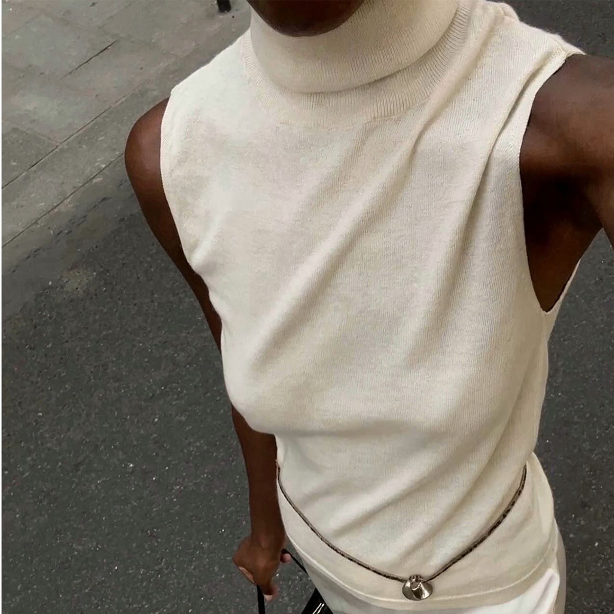 Woman in white knit top