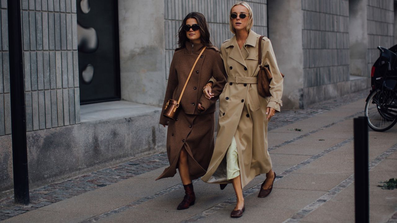 copenhagen fashion week fall 2024 attendees wearing brown trench coats 