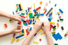 Lego sale: image of hands playing with lego