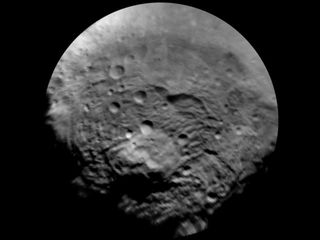NASA's Dawn spacecraft took this image of the south polar region of Vesta, which has a diameter of 330 miles (530 kilometers). The image was taken on July 9, 2011, and it has a scale of about 2.2 miles (3.5 km) per pixel. To enhance details, the resolution was enlarged to .6 miles (1 km) per pixel. This region is characterized by rough topography, a large mountain, impact craters, grooves and steep scarps.