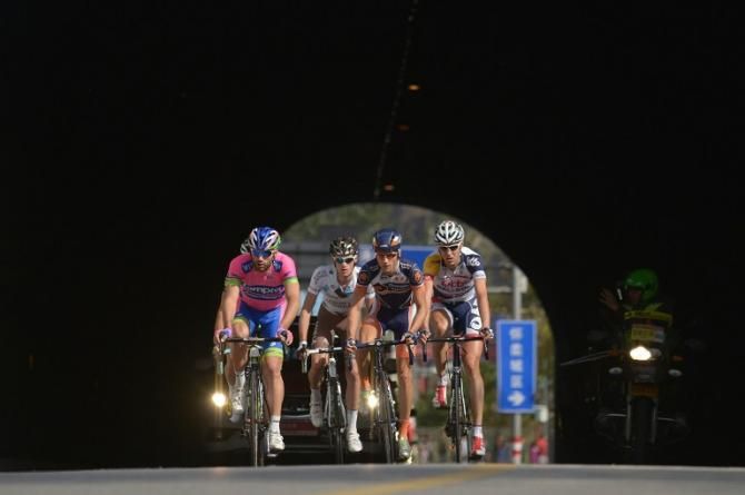 The breakaway emerges from a tunnel on stage 2 of Tour of Beijing