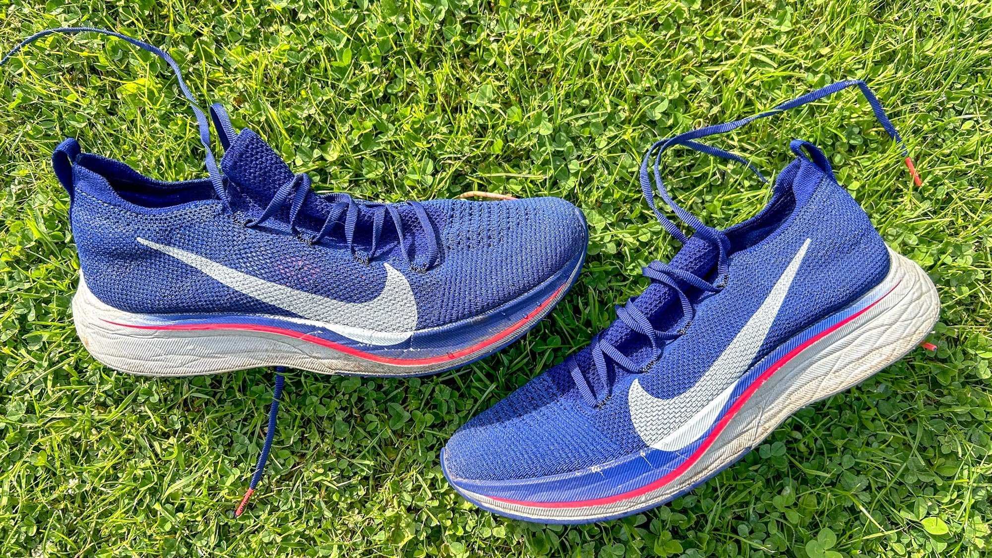 The Nike Vaporfly 4% running shoes on some grass