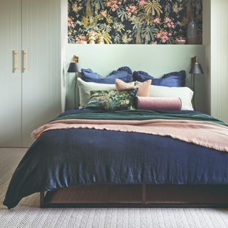 Bedroom with wooden wall paneling and floral wallpaper