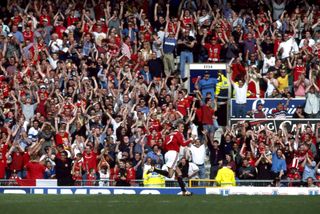 David Beckham celebrates with the Manchester United fans after scoring a free-kick against Aston Villa in May 1999.