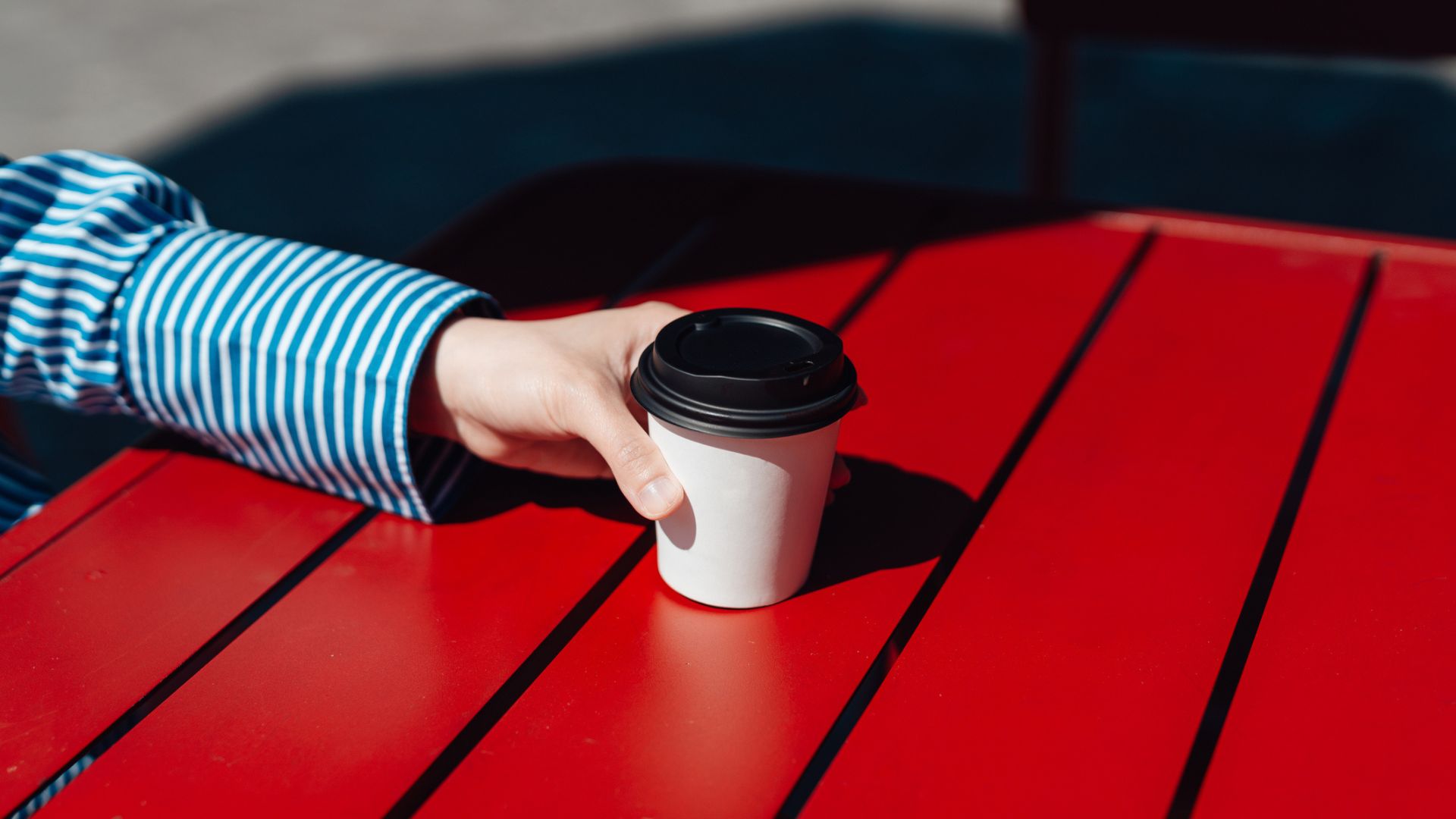 Woman holding cup of coffee