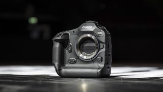 Canon EOS R1 mirrorless camera on the floor of a basketball court, under the lights