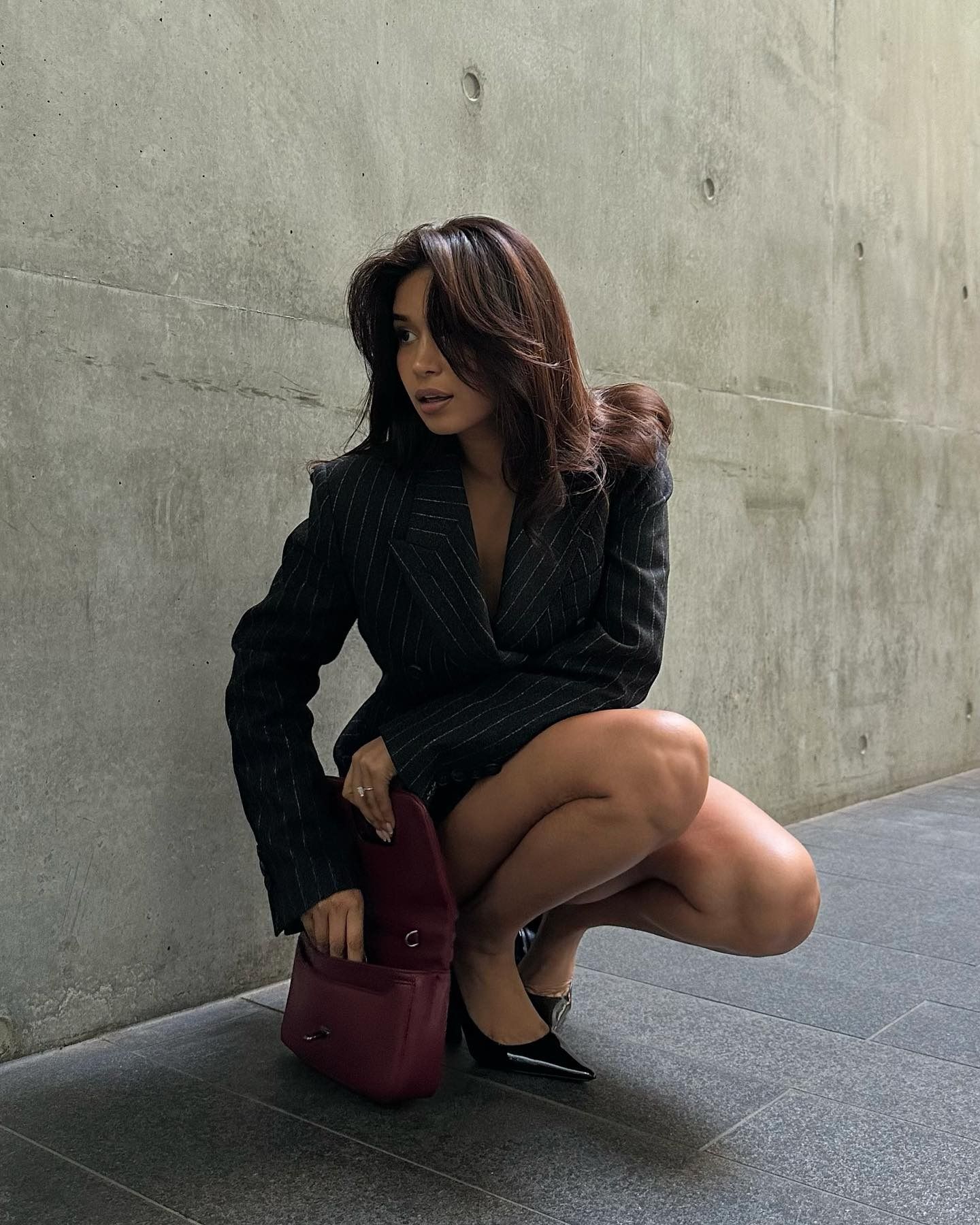 Creator @mishti.rahman taking a photo outside with shiny hair
