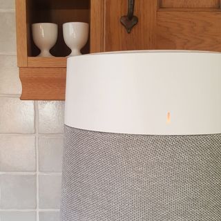 A close up of the Blueair Blue Max 3250i Air Purifier showing its indicator light displaying orange