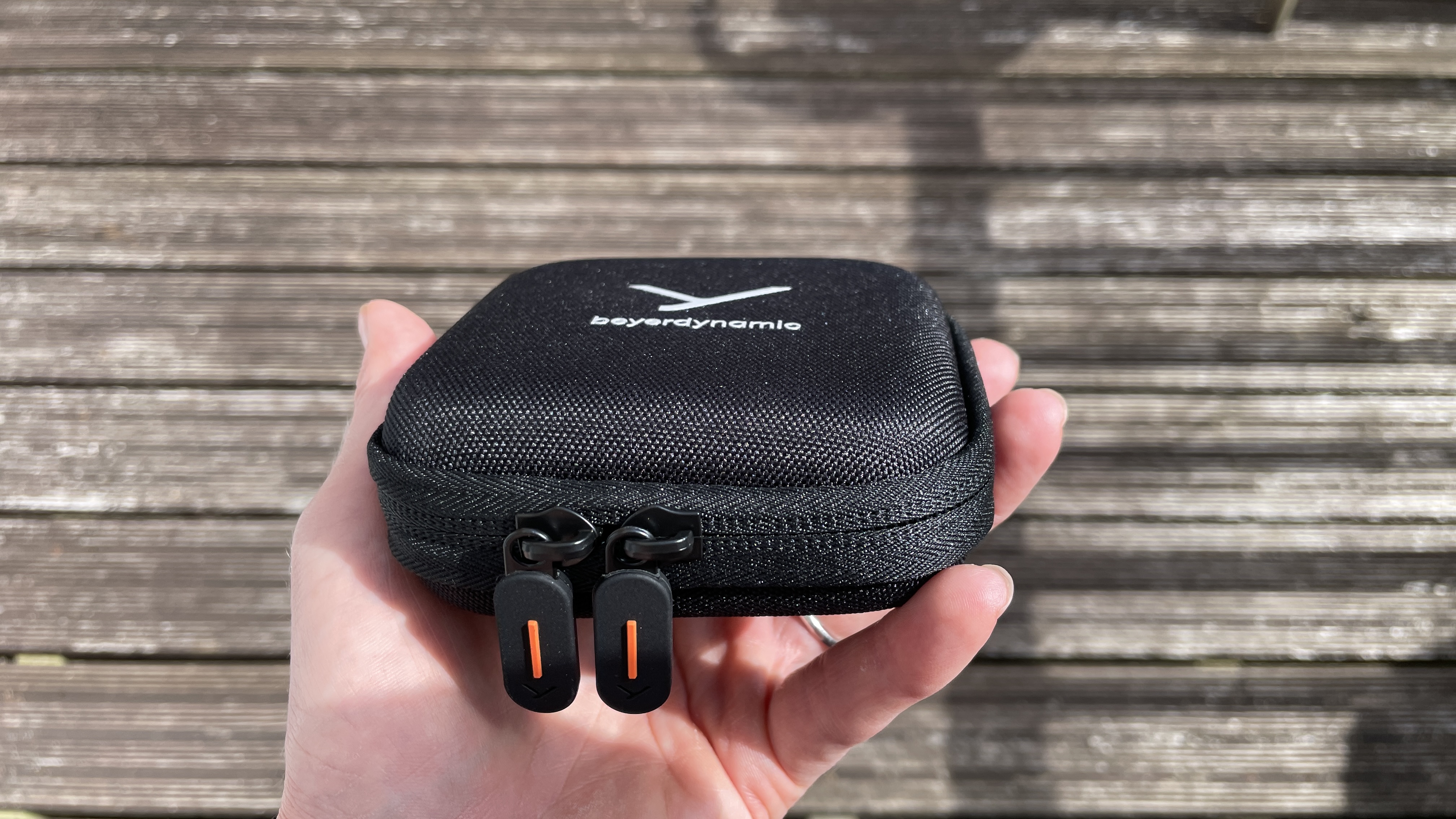 Beyerdynamic&#039;s DT 72 IE earbuds for vocals and guitar on brown background, showcasing the accessories