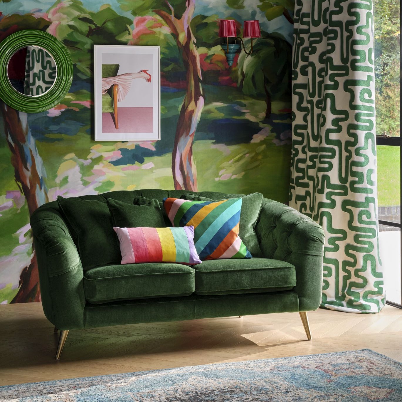 Living room with green sofa a wall mural