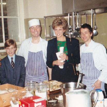 Prince William posing with Princess Diana and two men wearing aprons in the kitchen of charity The Passage